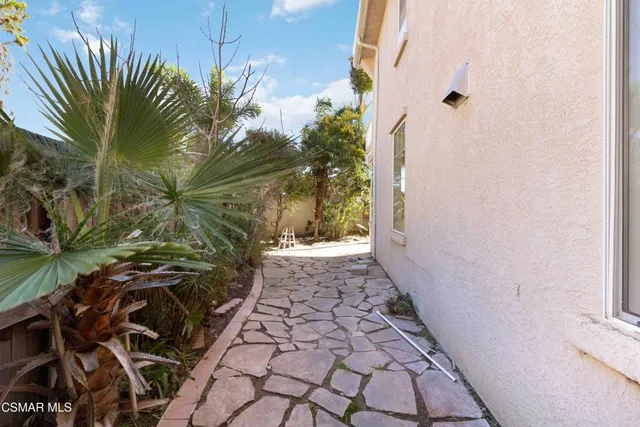 a view of a building with brick walls