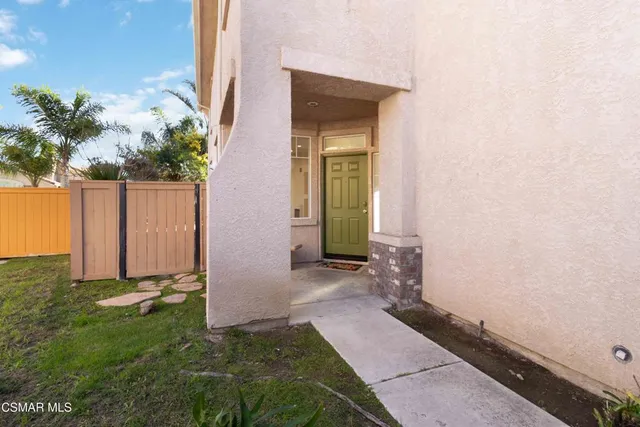 a view of a backyard with potted plants