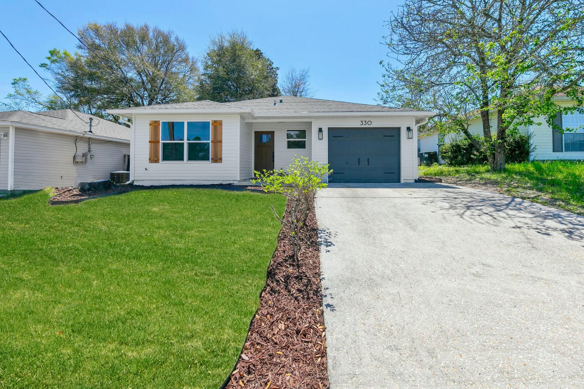 a view of a house with a garden