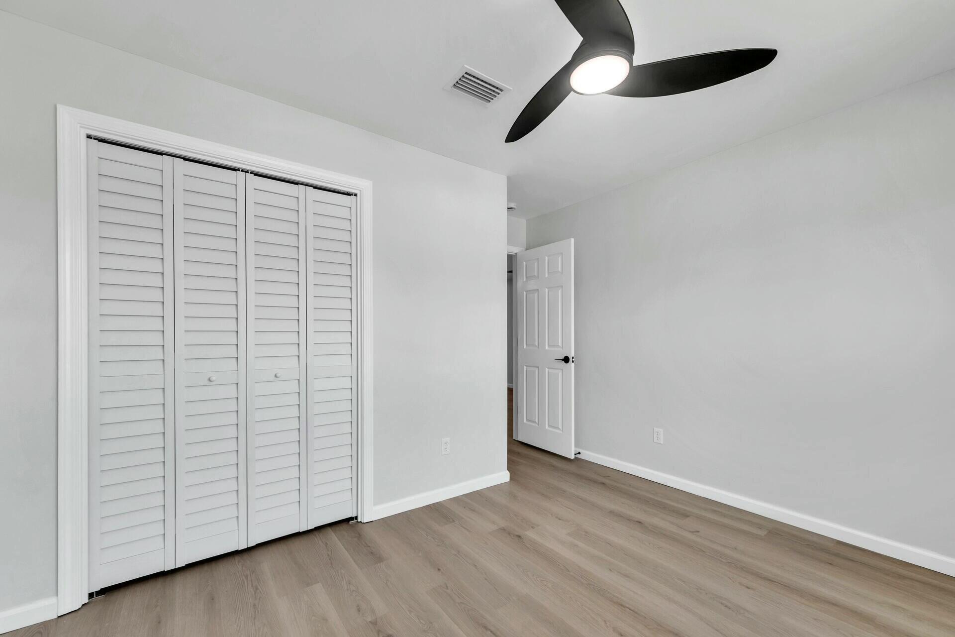 330 Apple Drive Crestview, FL 32536 - Photo 14 of 29 wooden floor in an empty room
