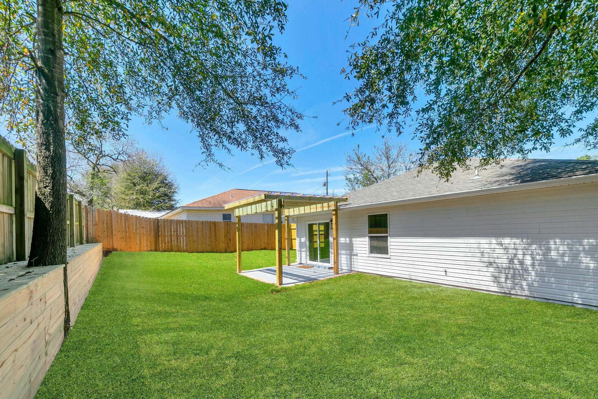 330 Apple Drive Crestview, FL 32536 - Photo 26 of 29 a view of a backyard with a garden