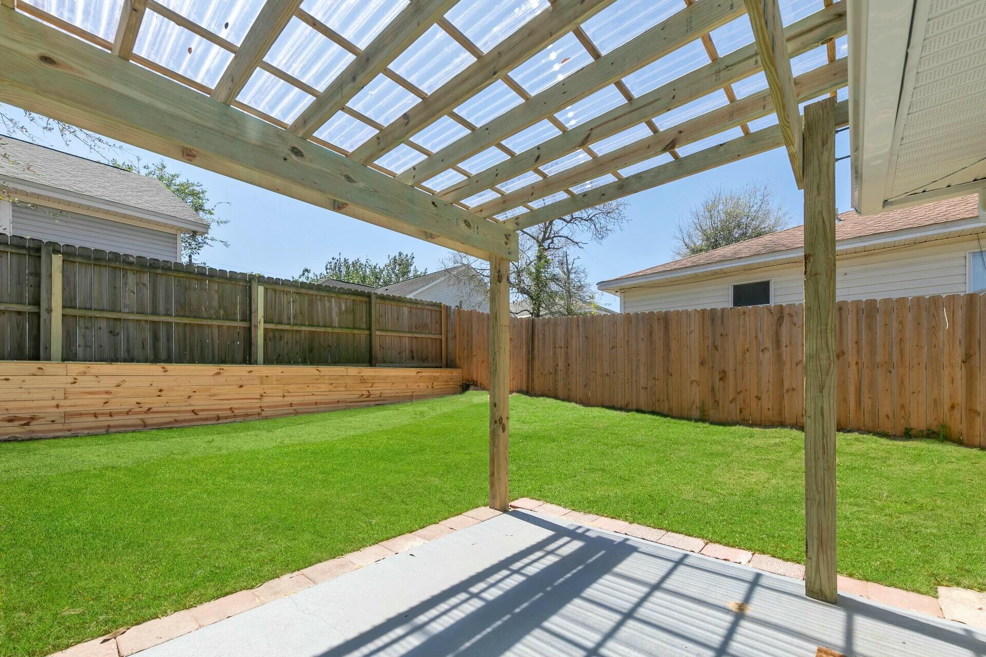 330 Apple Drive Crestview, FL 32536 - Photo 27 of 29 a view of a backyard with a garden