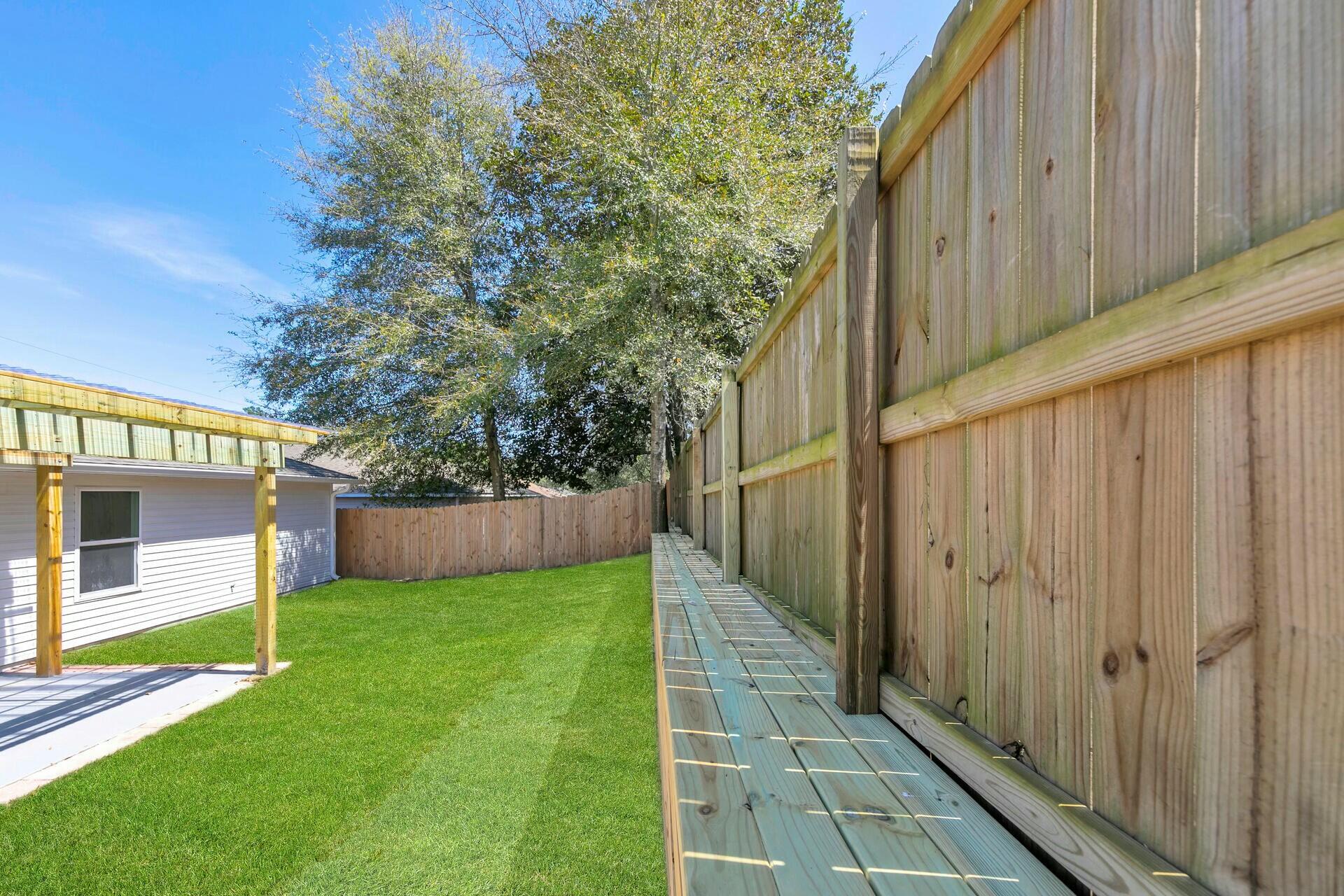 330 Apple Drive Crestview, FL 32536 - Photo 28 of 29 a view of yard with small space and wooden fence