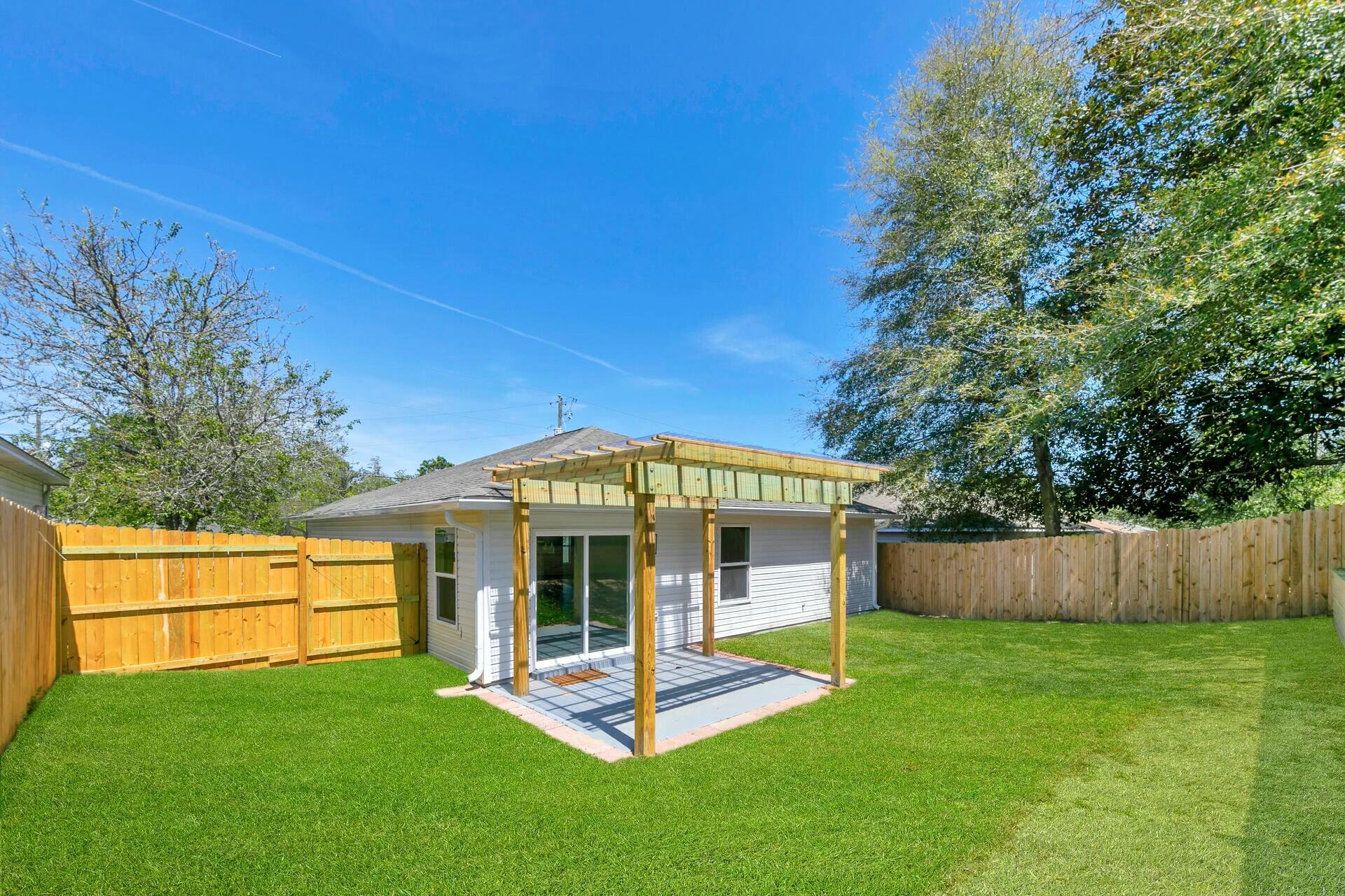 330 Apple Drive Crestview, FL 32536 - Photo 29 of 29 a view of a house with a yard porch and sitting area