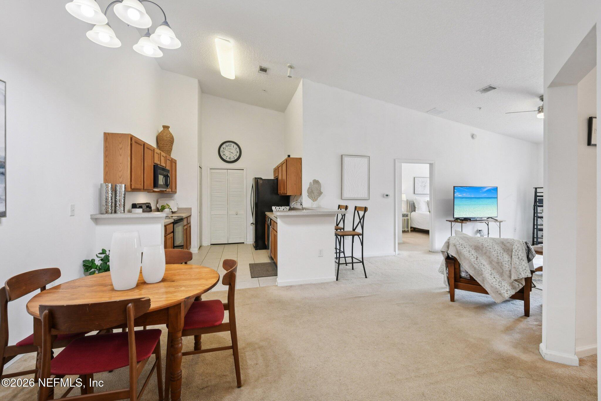 7920 Merrill Road, Unit 1114 Jacksonville, FL 32277 - Photo 11 of 31 a view of kitchen with cabinets and wooden floor