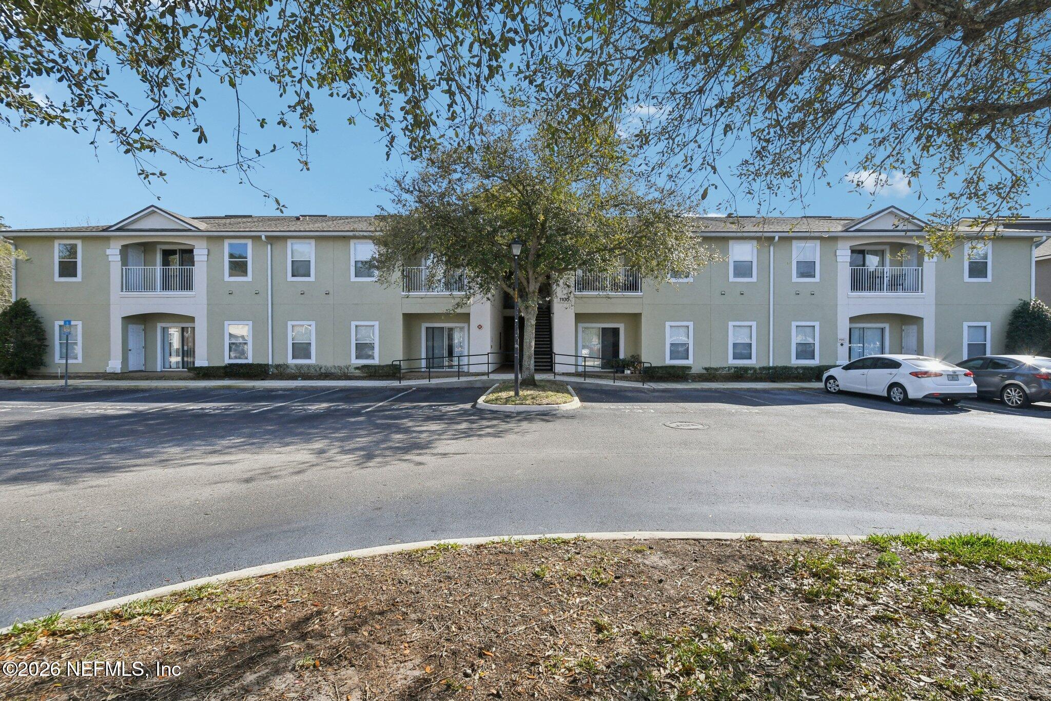 7920 Merrill Road, Unit 1114 Jacksonville, FL 32277 - Photo 30 of 31 a view of a building with a street
