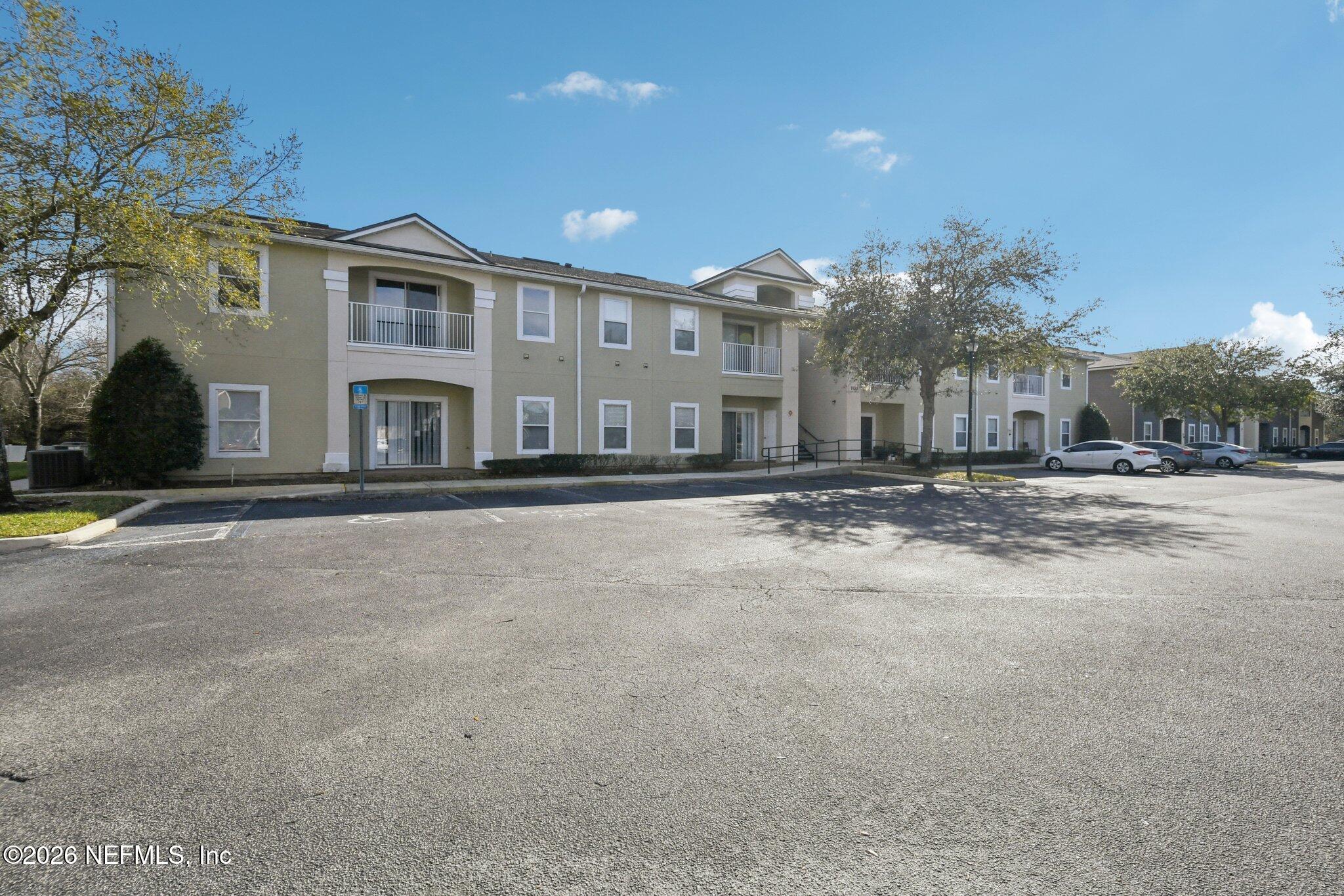 7920 Merrill Road, Unit 1114 Jacksonville, FL 32277 - Photo 5 of 31 a front view of a building with street view