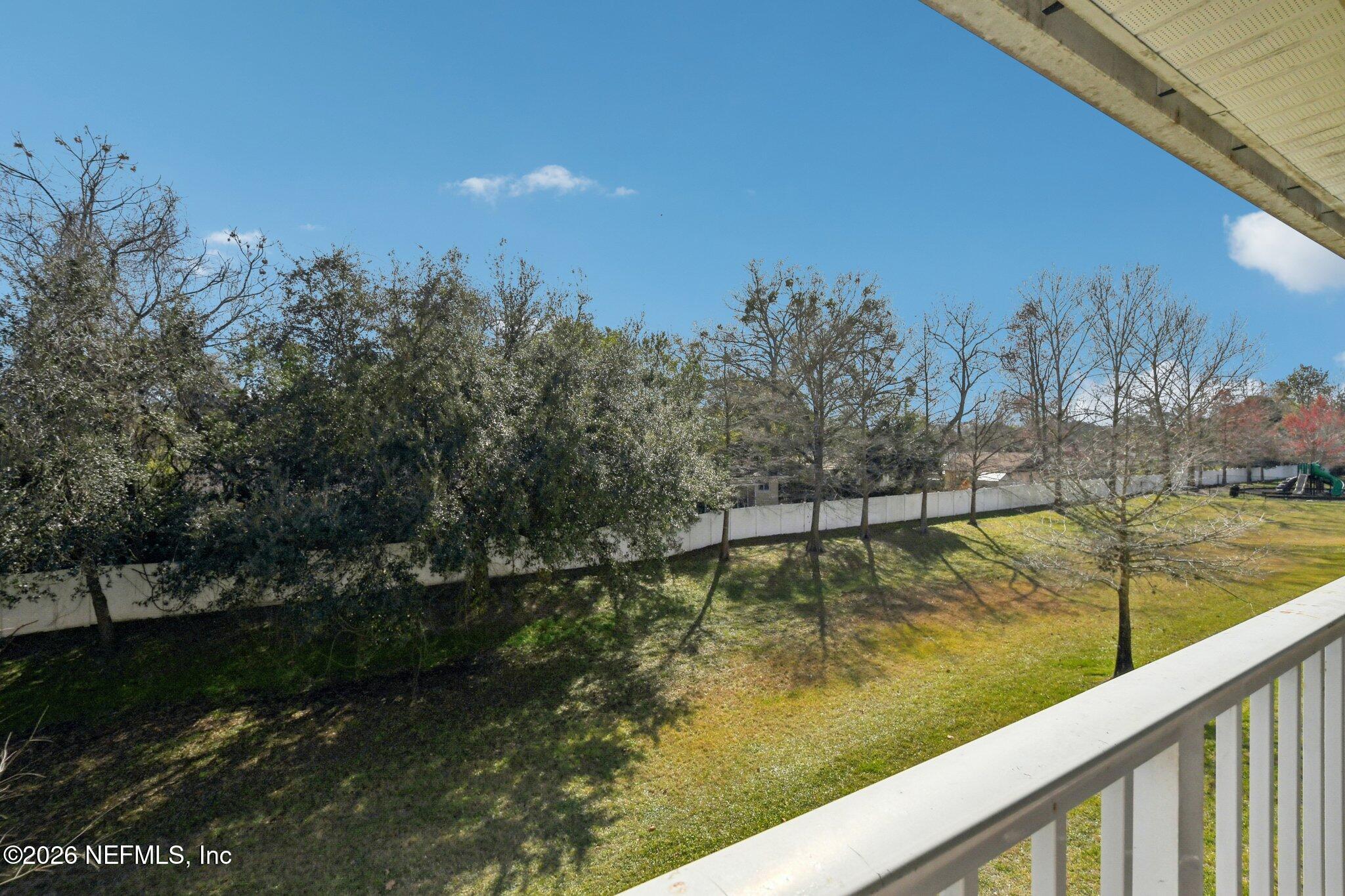 7920 Merrill Road, Unit 1114 Jacksonville, FL 32277 - Photo 6 of 31 a view of a lake with a yard