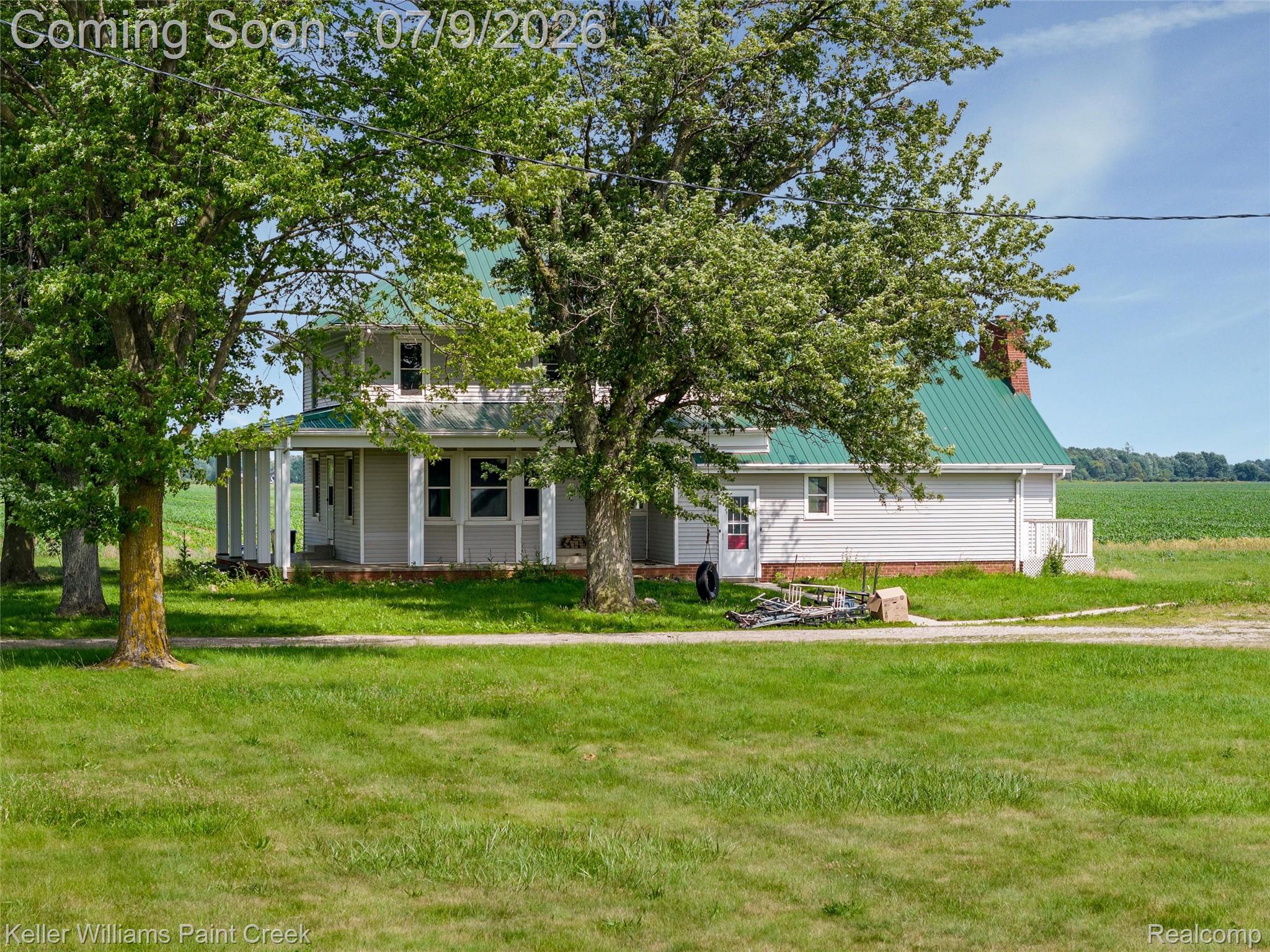 28780 School Section Road Richmond, MI 48062 - Photo 39 of 50 Two-story residence featuring a green metal roof and light gray siding