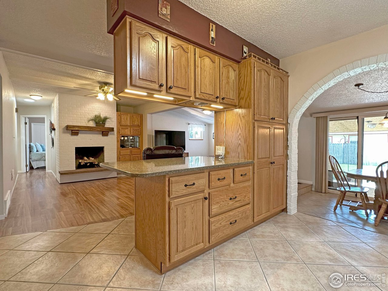 807 Locust Street Windsor, CO 80550 - Photo 40 of 40 a kitchen with stainless steel appliances granite countertop a stove and cabinets