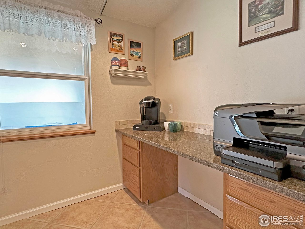807 Locust Street Windsor, CO 80550 - Photo 12 of 40 a kitchen with sink and cabinets