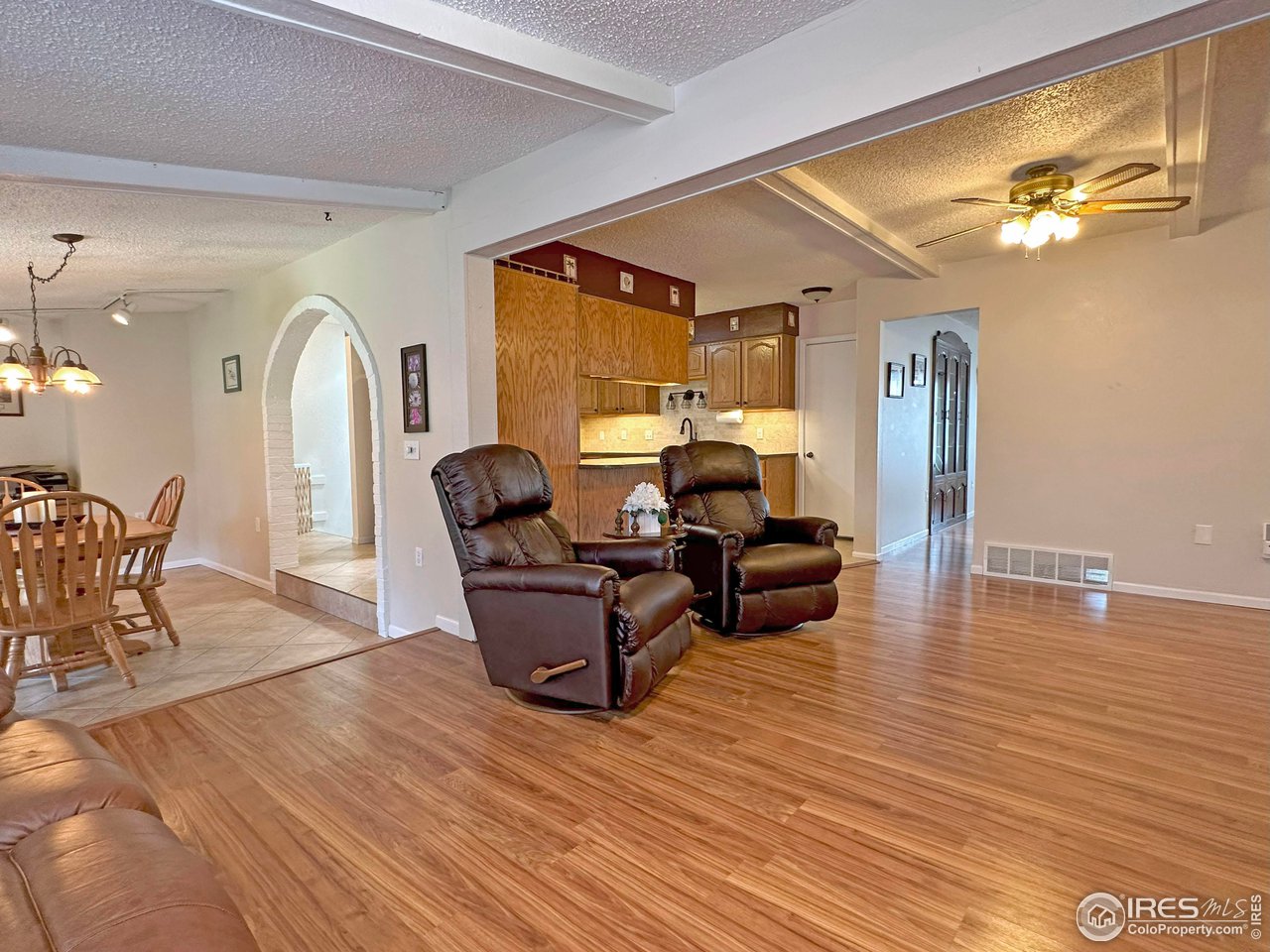 807 Locust Street Windsor, CO 80550 - Photo 14 of 40 a living room with furniture and a wooden floor