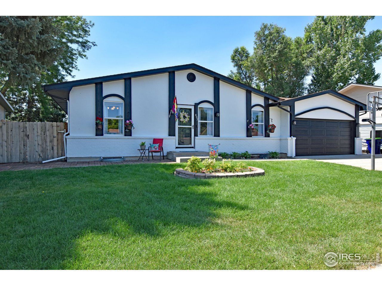 807 Locust Street Windsor, CO 80550 - Photo 2 of 40 a front view of house with yard and green space