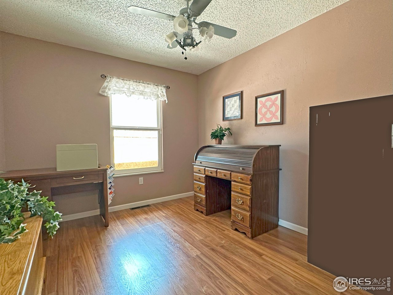807 Locust Street Windsor, CO 80550 - Photo 20 of 40 a view of a livingroom with furniture and wooden floor