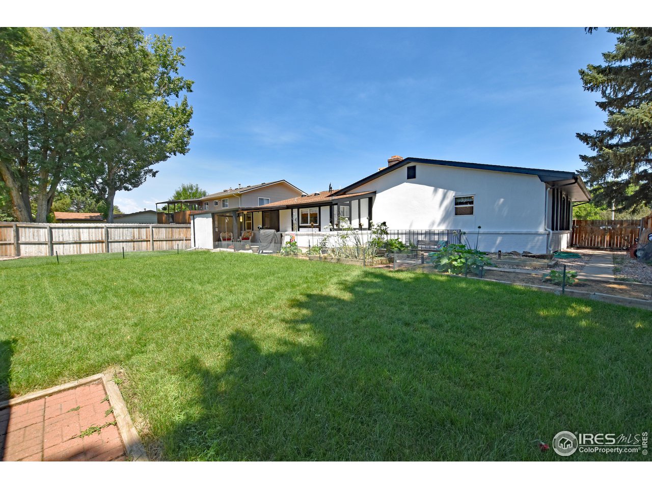807 Locust Street Windsor, CO 80550 - Photo 35 of 40 a front view of a house with a garden