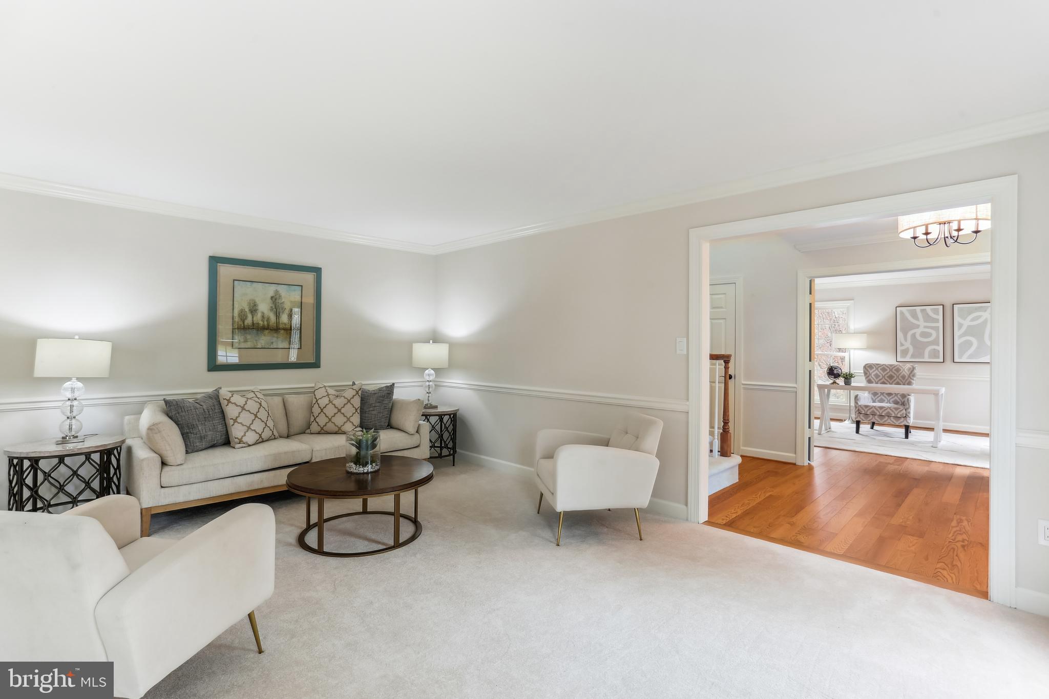 9409 Thornedike Drive Laytonsville, MD 20882 - Photo 14 of 86 a living room with furniture and a couch