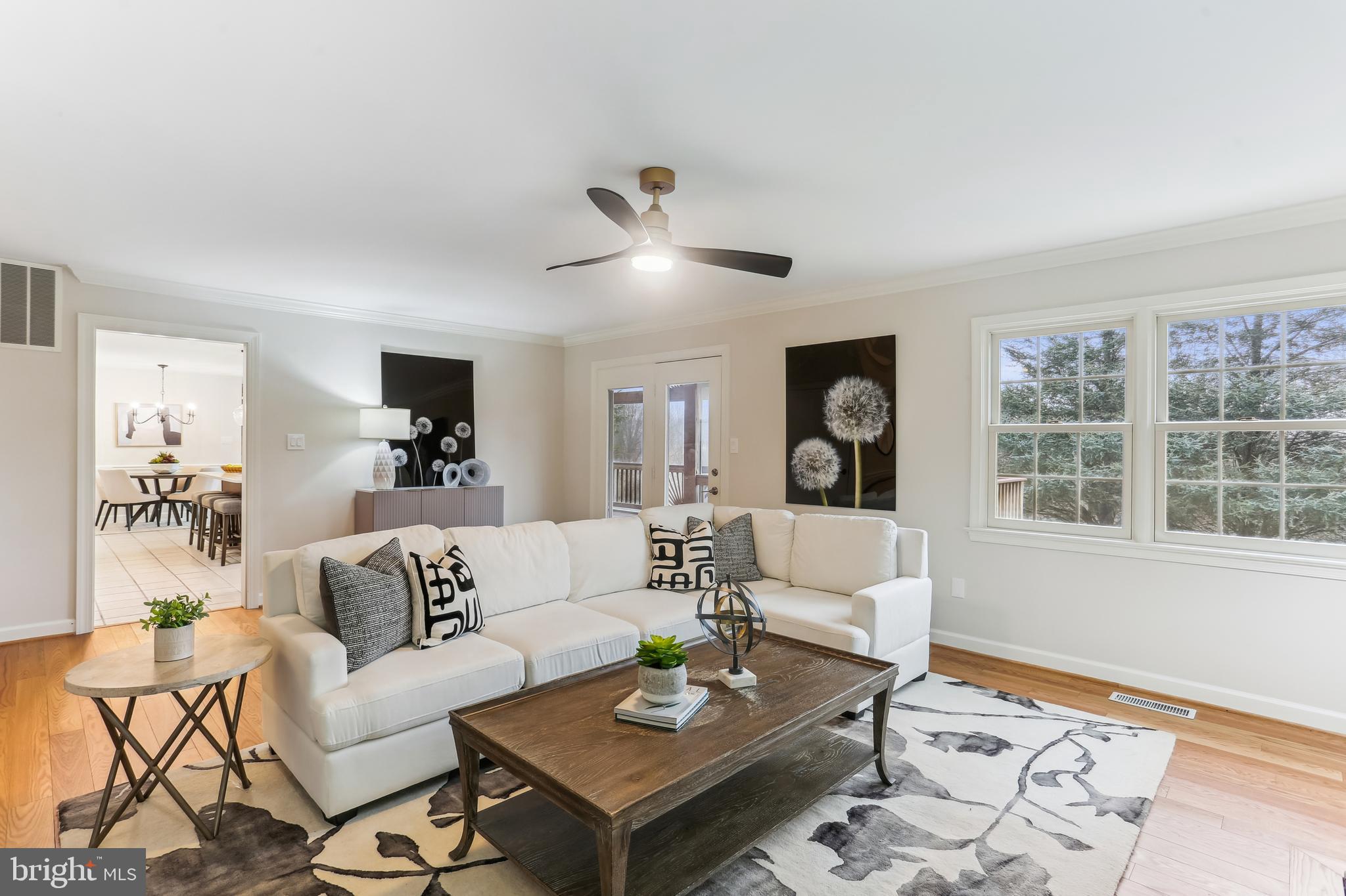 9409 Thornedike Drive Laytonsville, MD 20882 - Photo 26 of 86 a living room with furniture and a window