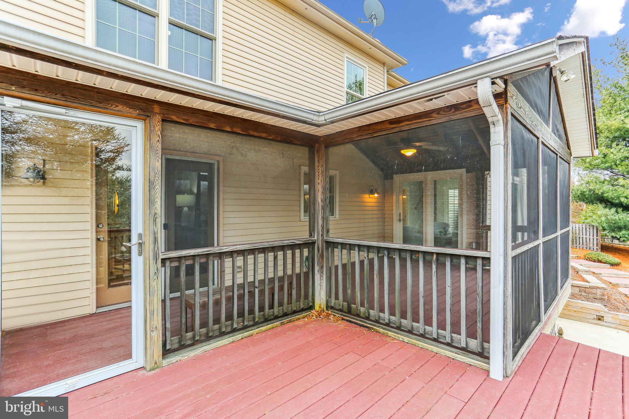 9409 Thornedike Drive Laytonsville, MD 20882 - Photo 34 of 86 a view of a balcony with wooden floor