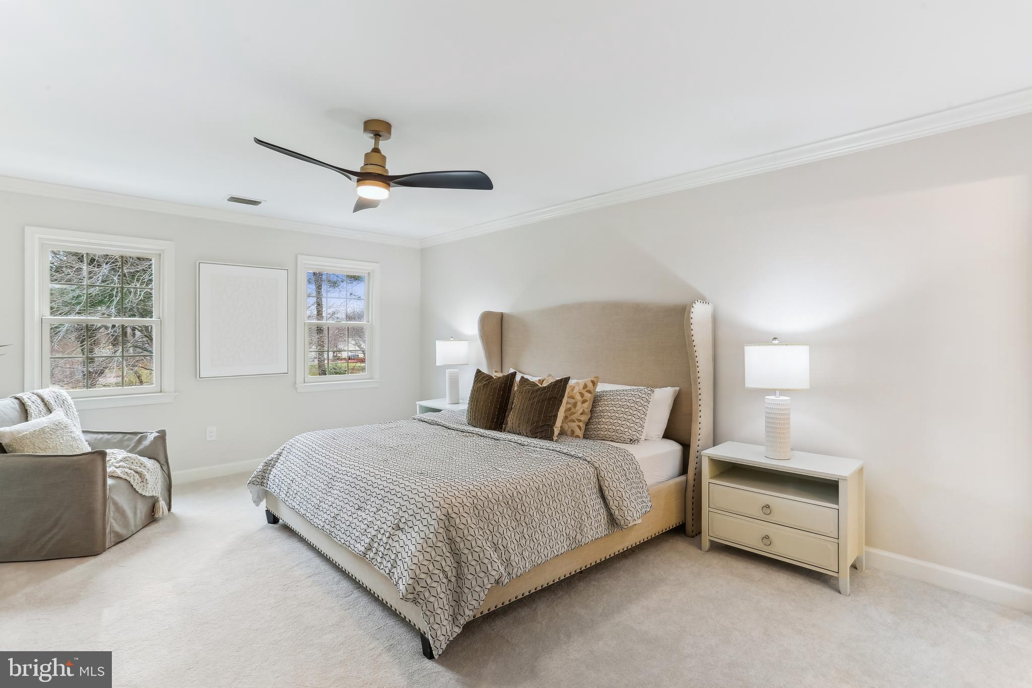 9409 Thornedike Drive Laytonsville, MD 20882 - Photo 41 of 86 a bedroom with a bed and a couch