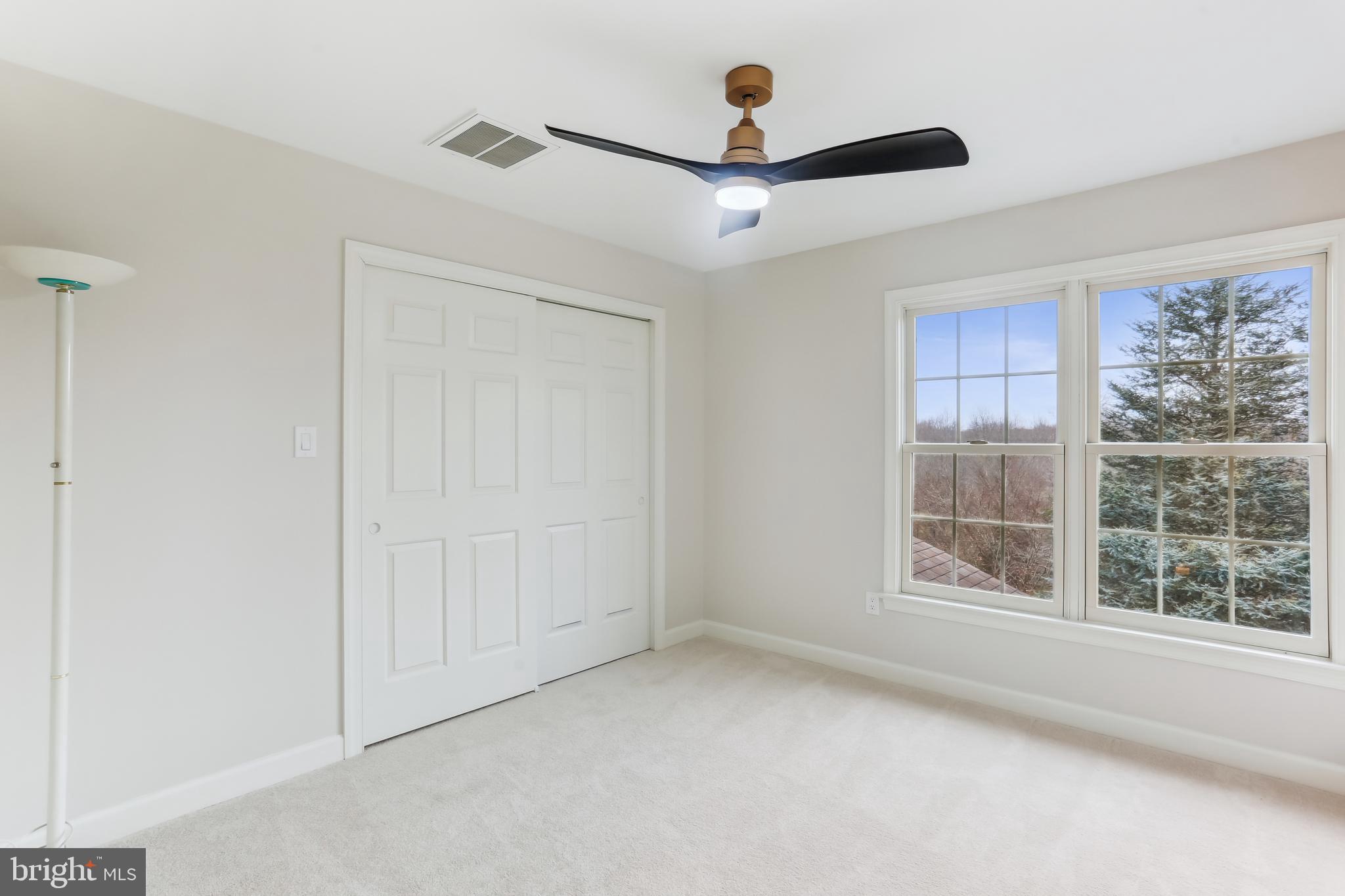 9409 Thornedike Drive Laytonsville, MD 20882 - Photo 49 of 86 wooden floor in an empty room with a window
