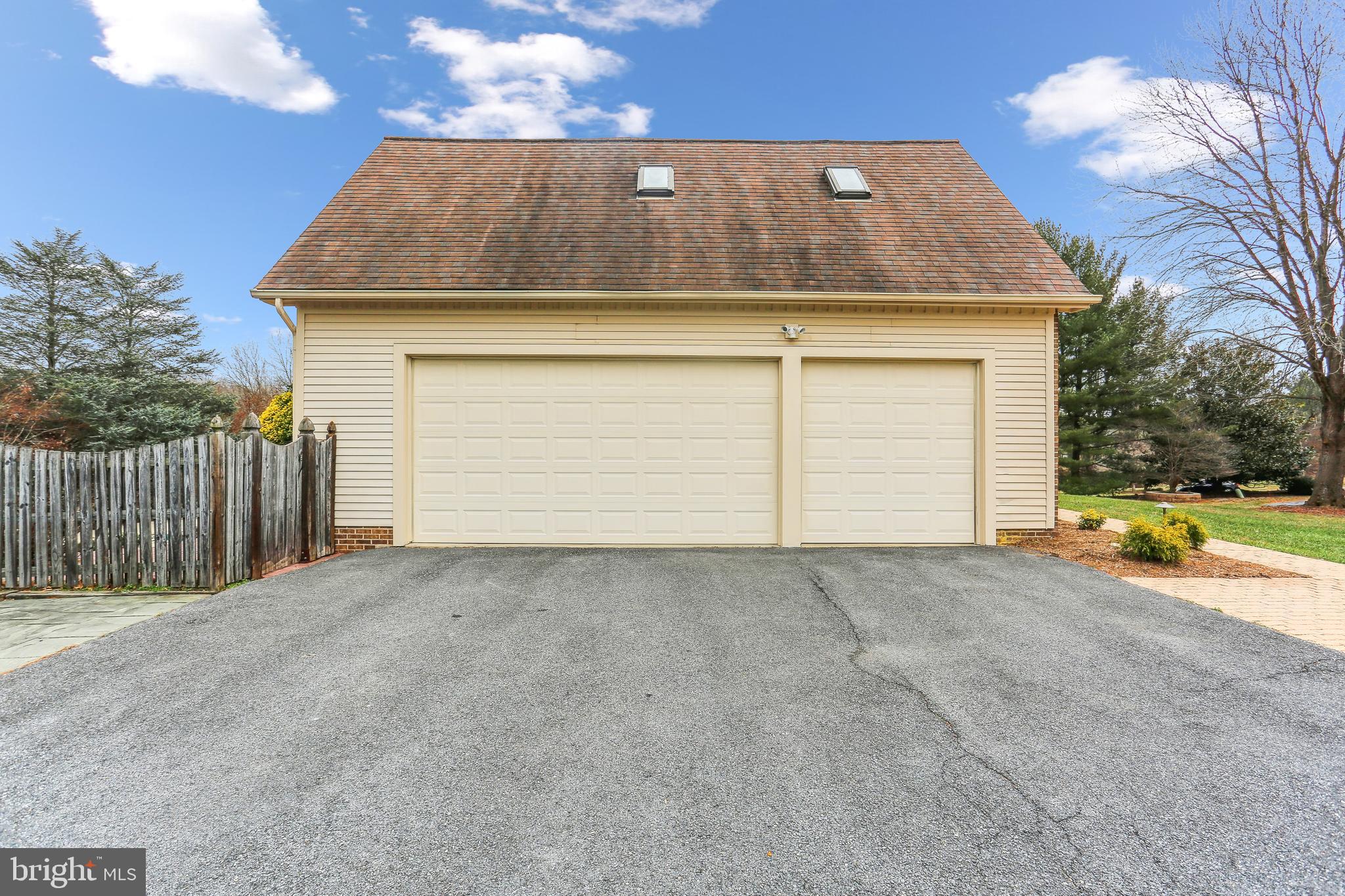9409 Thornedike Drive Laytonsville, MD 20882 - Photo 5 of 86 a view of a house with a yard and garage