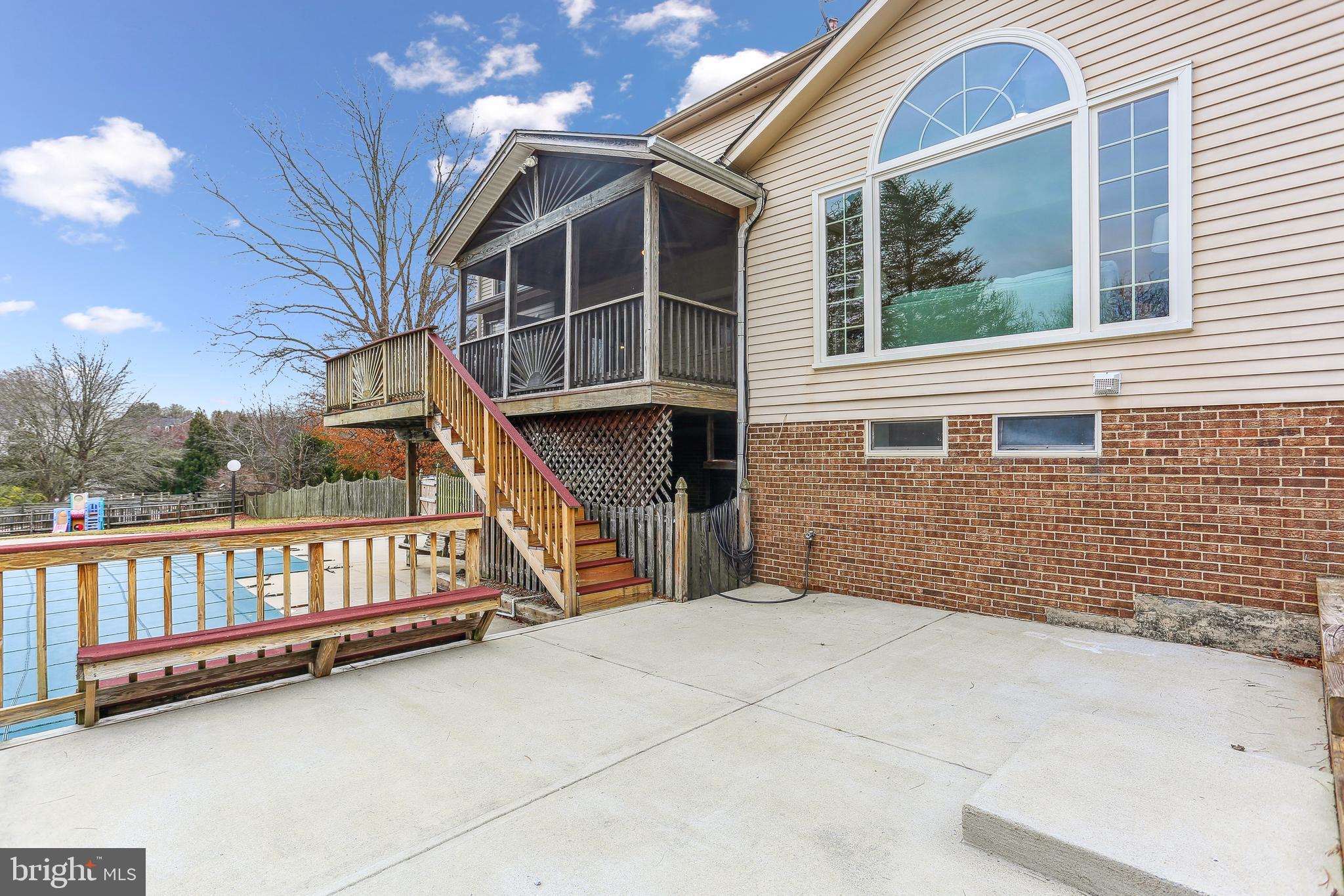 9409 Thornedike Drive Laytonsville, MD 20882 - Photo 79 of 86 a view of a house with staircase and a porch
