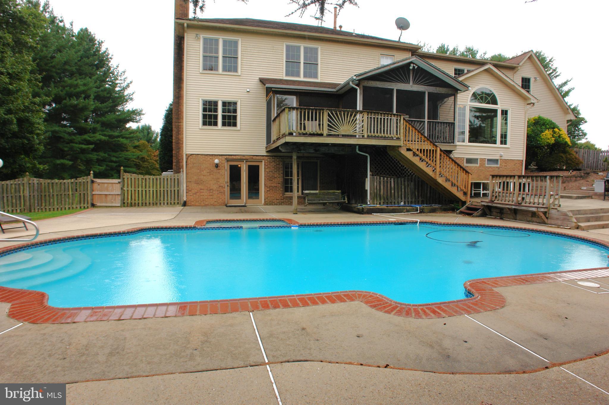 9409 Thornedike Drive Laytonsville, MD 20882 - Photo 81 of 86 a front view of a house with swimming pool