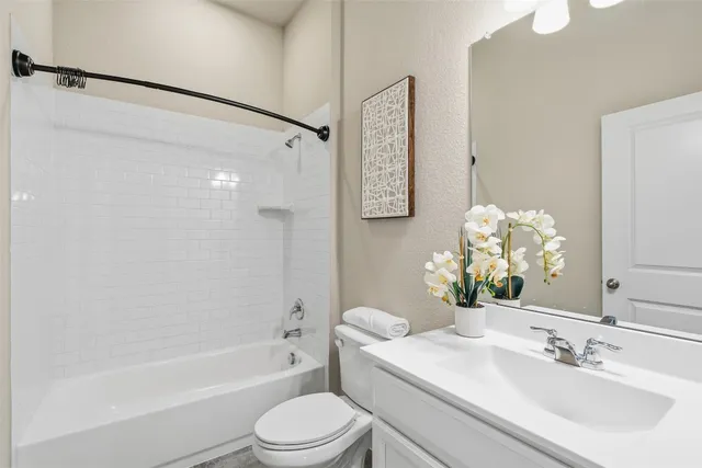 a view of bathroom with a sink mirror and shower