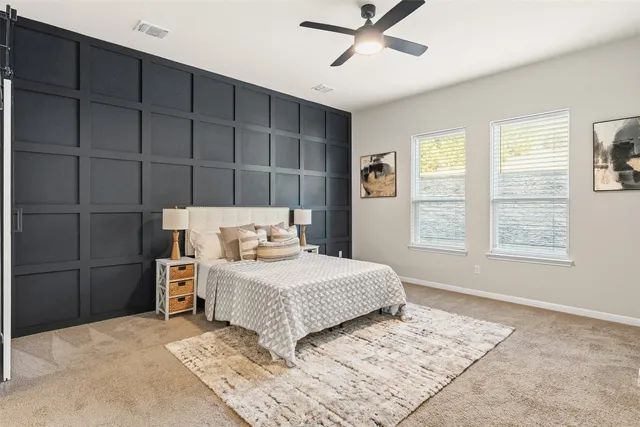 an empty room with windows and entrance