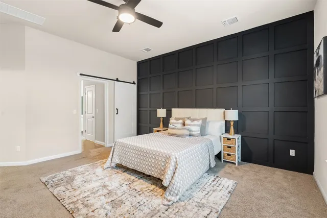 a bathroom with a bathtub shower sink mirror vanity and toilet