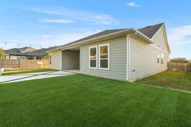 a bathroom with a double vanity sink bathtub and a window