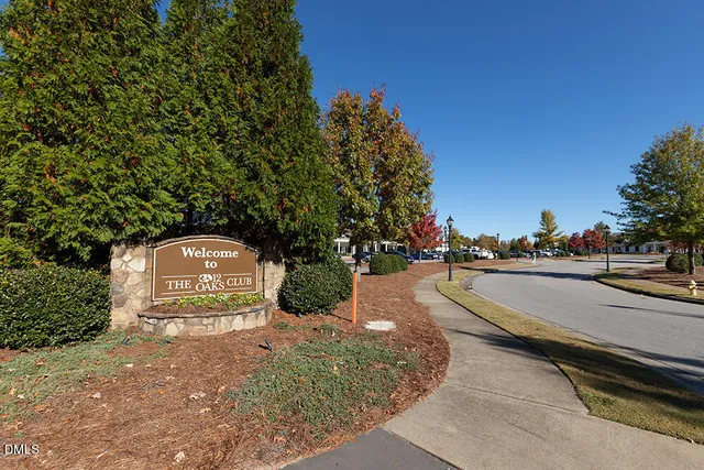 a front view of a residential apartment building with a yard