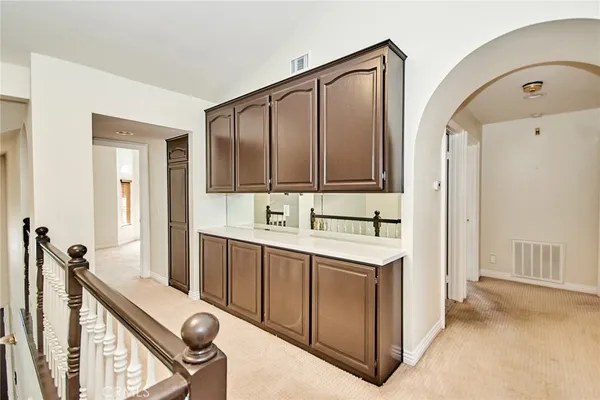 a view of a kitchen with electric appliances