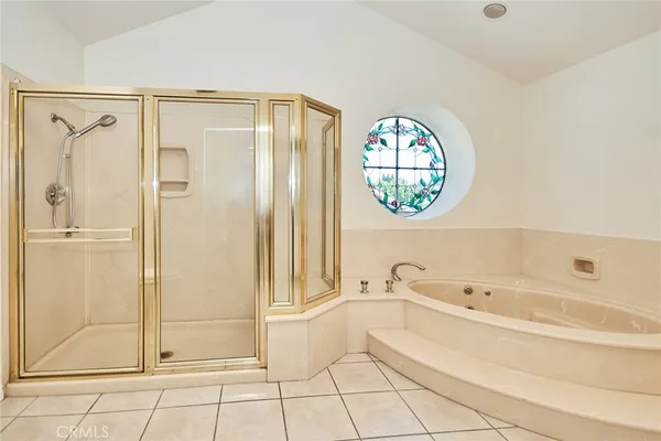 a bathroom with a bathtub and a shower