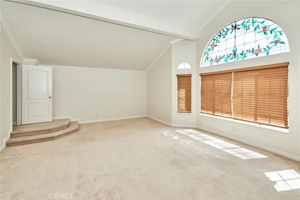an empty room with a large window