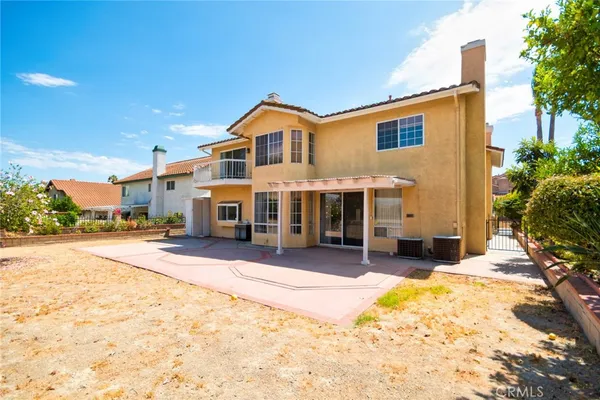 a front view of a house with a yard outdoor seating and garage