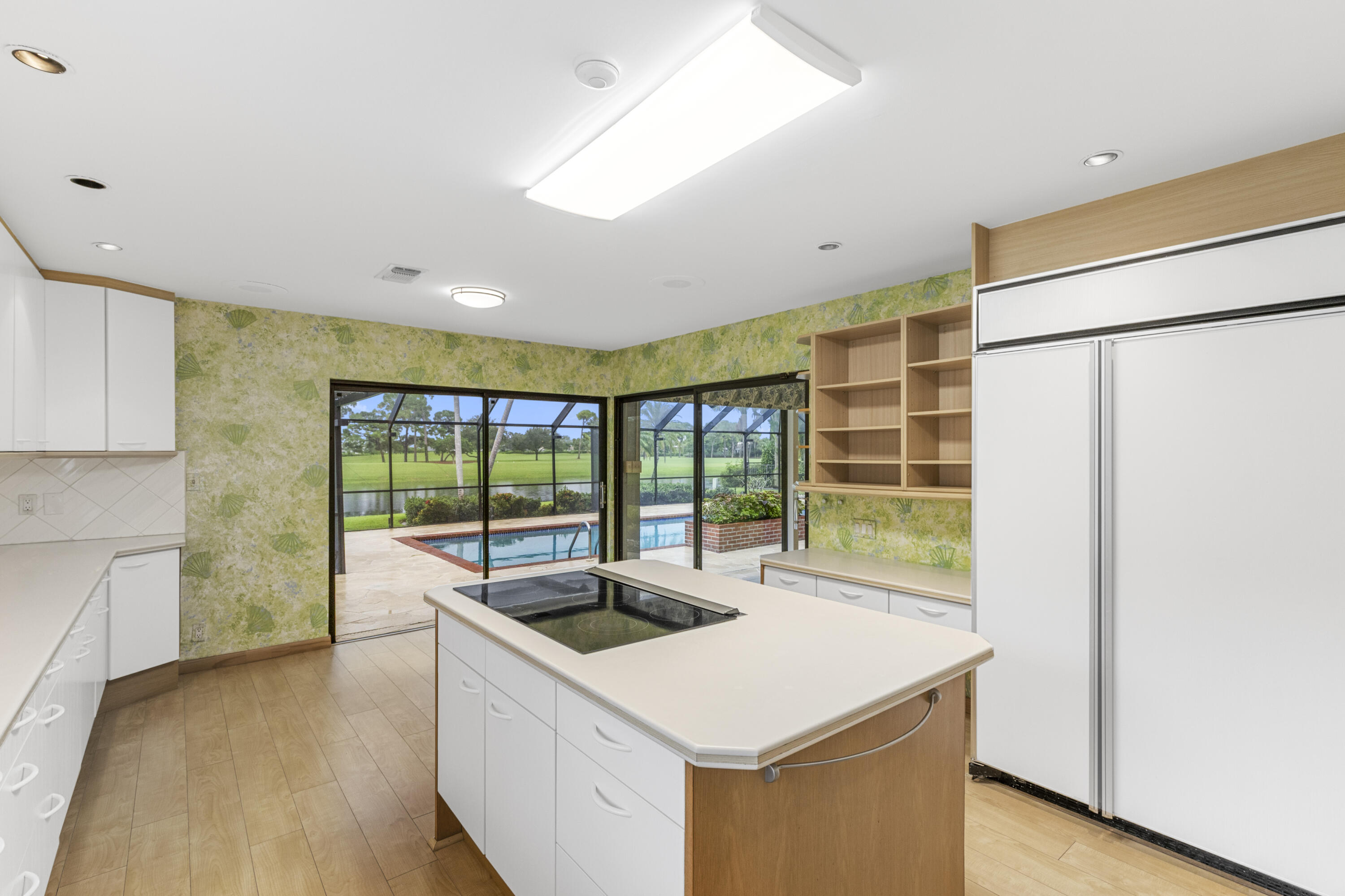 Undisclosed Address Delray Beach, FL 33445 - Photo 12 of 44 a kitchen with a sink and a large window