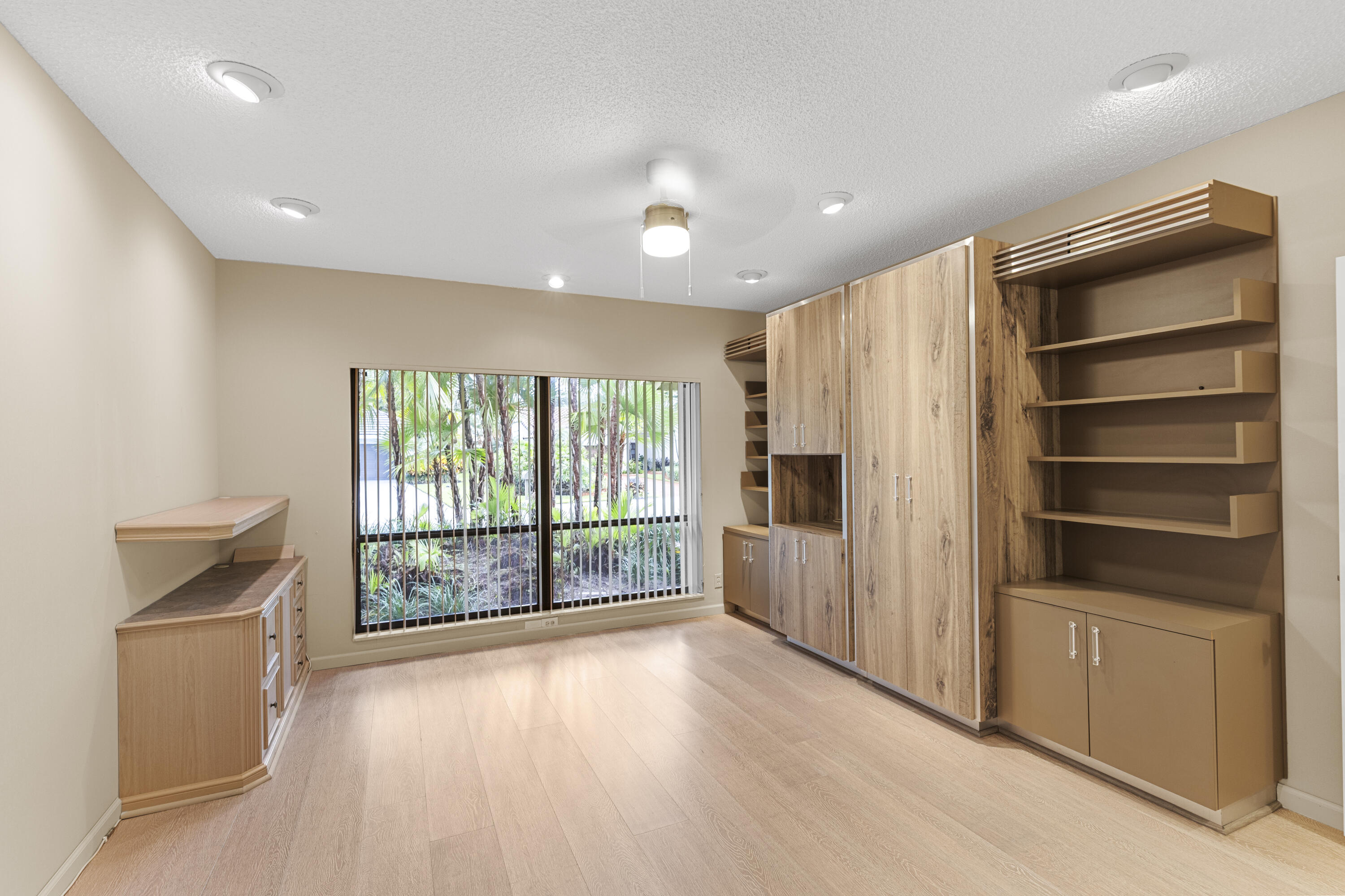 Undisclosed Address Delray Beach, FL 33445 - Photo 17 of 44 a view of walk in closet with wooden floor