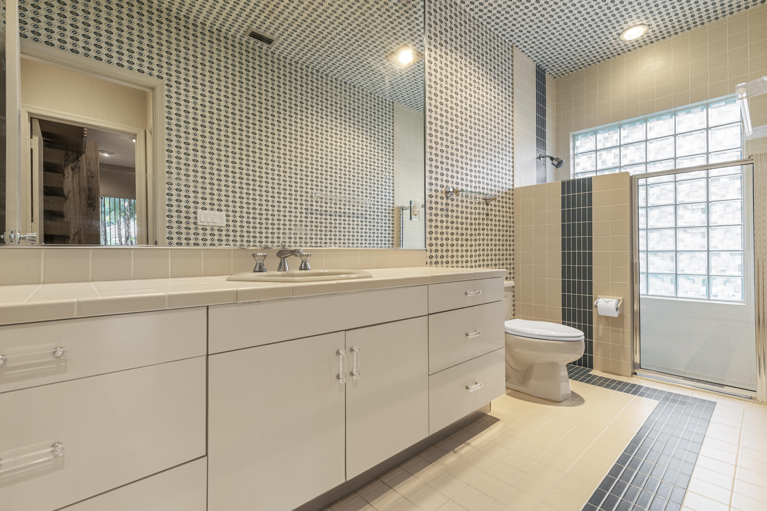 Undisclosed Address Delray Beach, FL 33445 - Photo 19 of 44 a bathroom with a sink toilet and shower