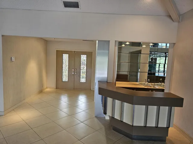 a kitchen with a sink and a large window