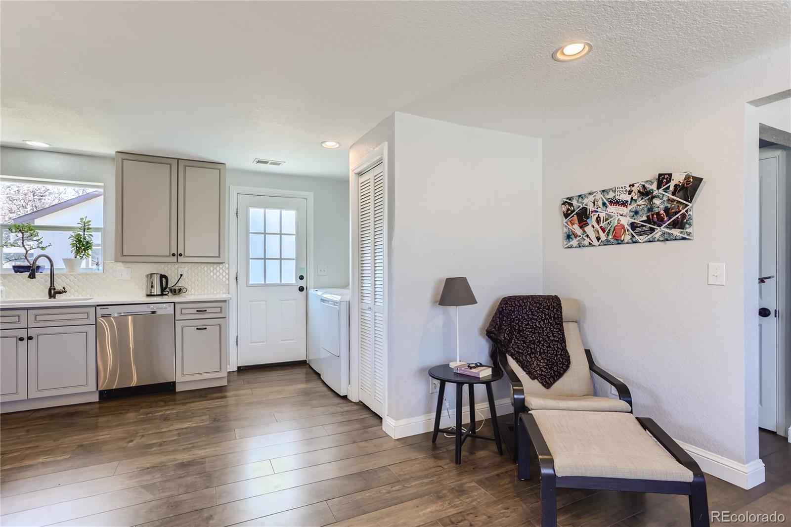 3051 Grape Street Denver, CO 80207 - Photo 12 of 33 a workspace with furniture and wooden floor