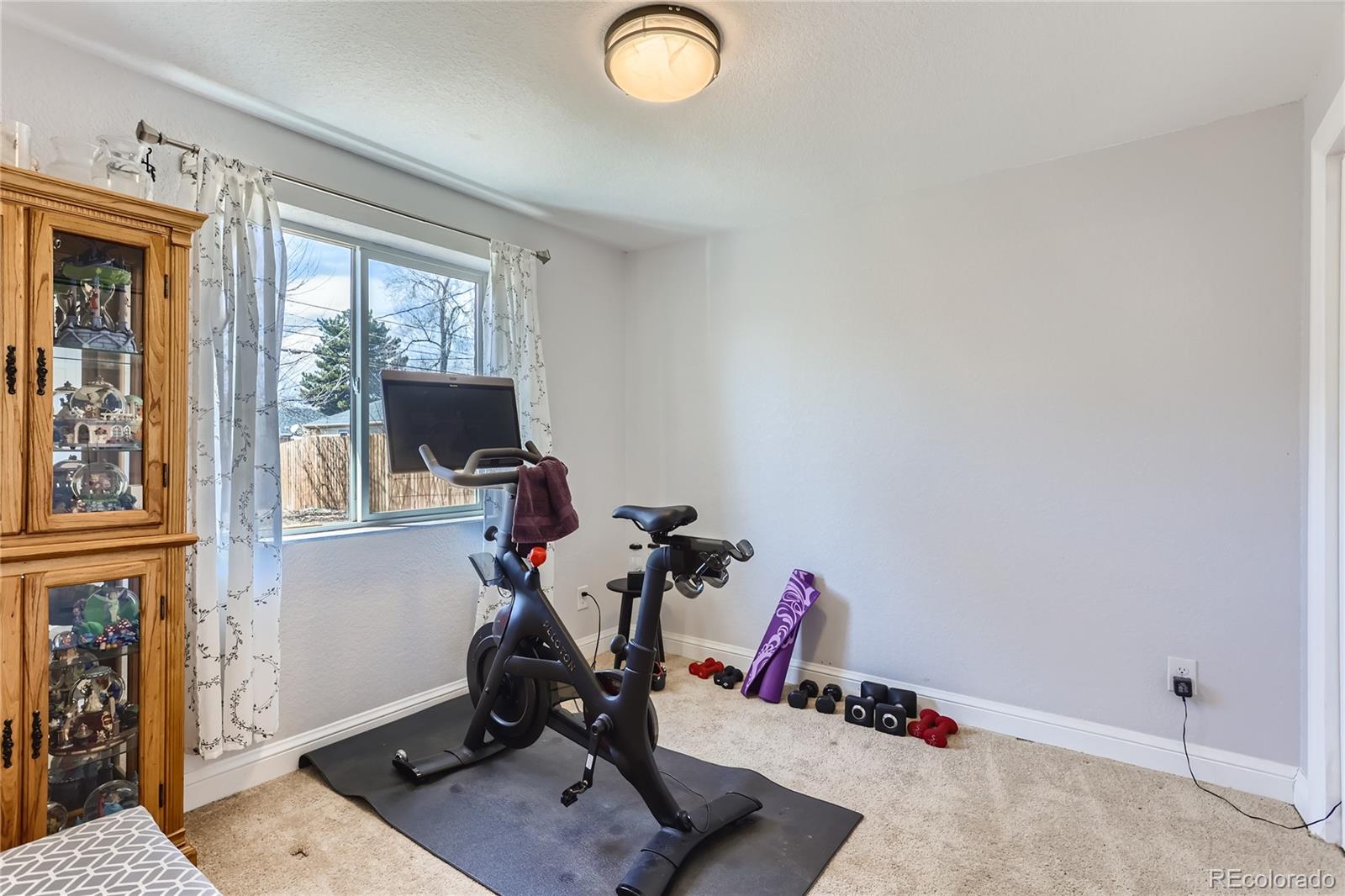 3051 Grape Street Denver, CO 80207 - Photo 24 of 33 a view of a workspace with furniture and a window