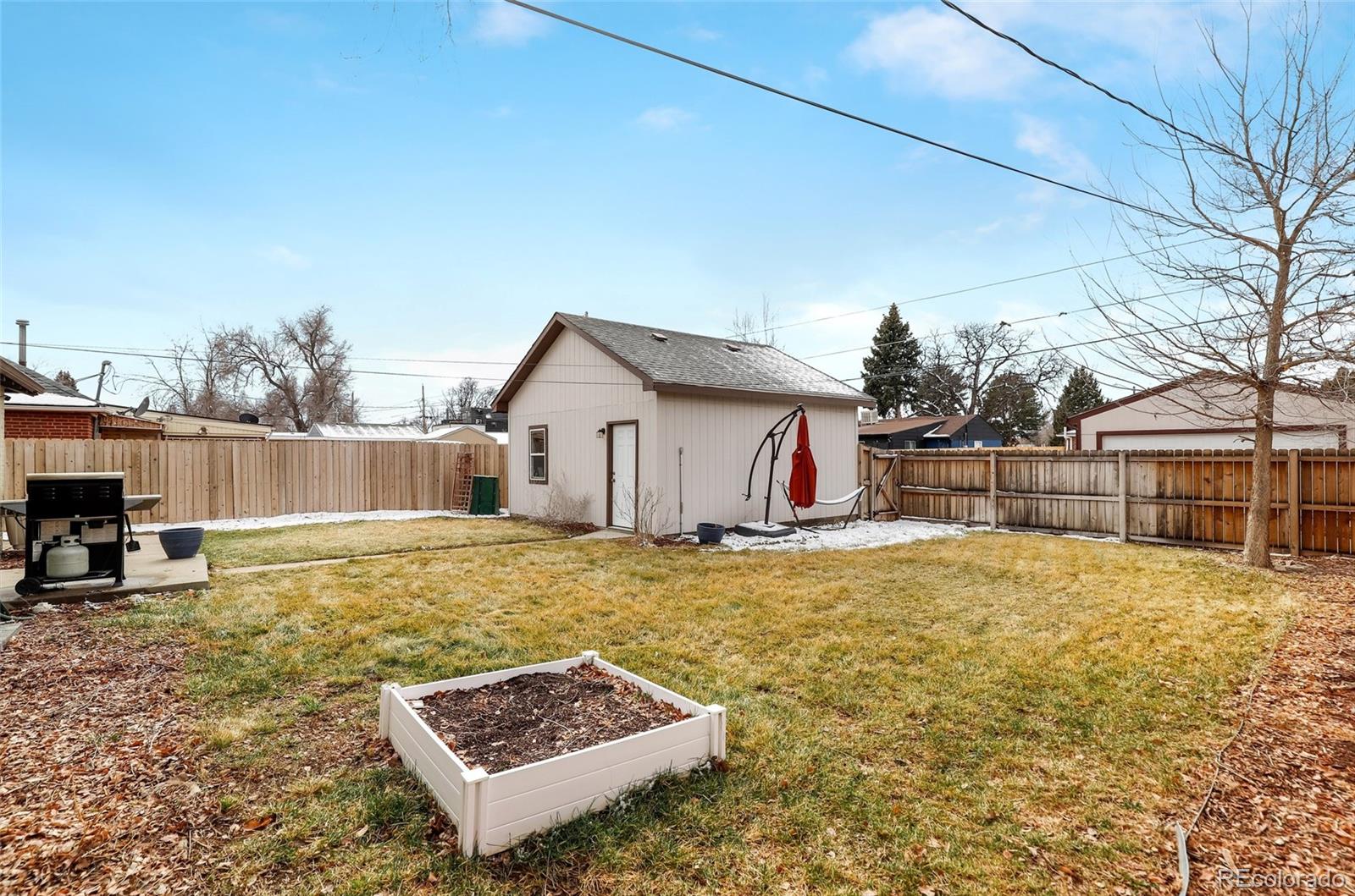 3051 Grape Street Denver, CO 80207 - Photo 28 of 33 a view of a house with backyard and sitting area