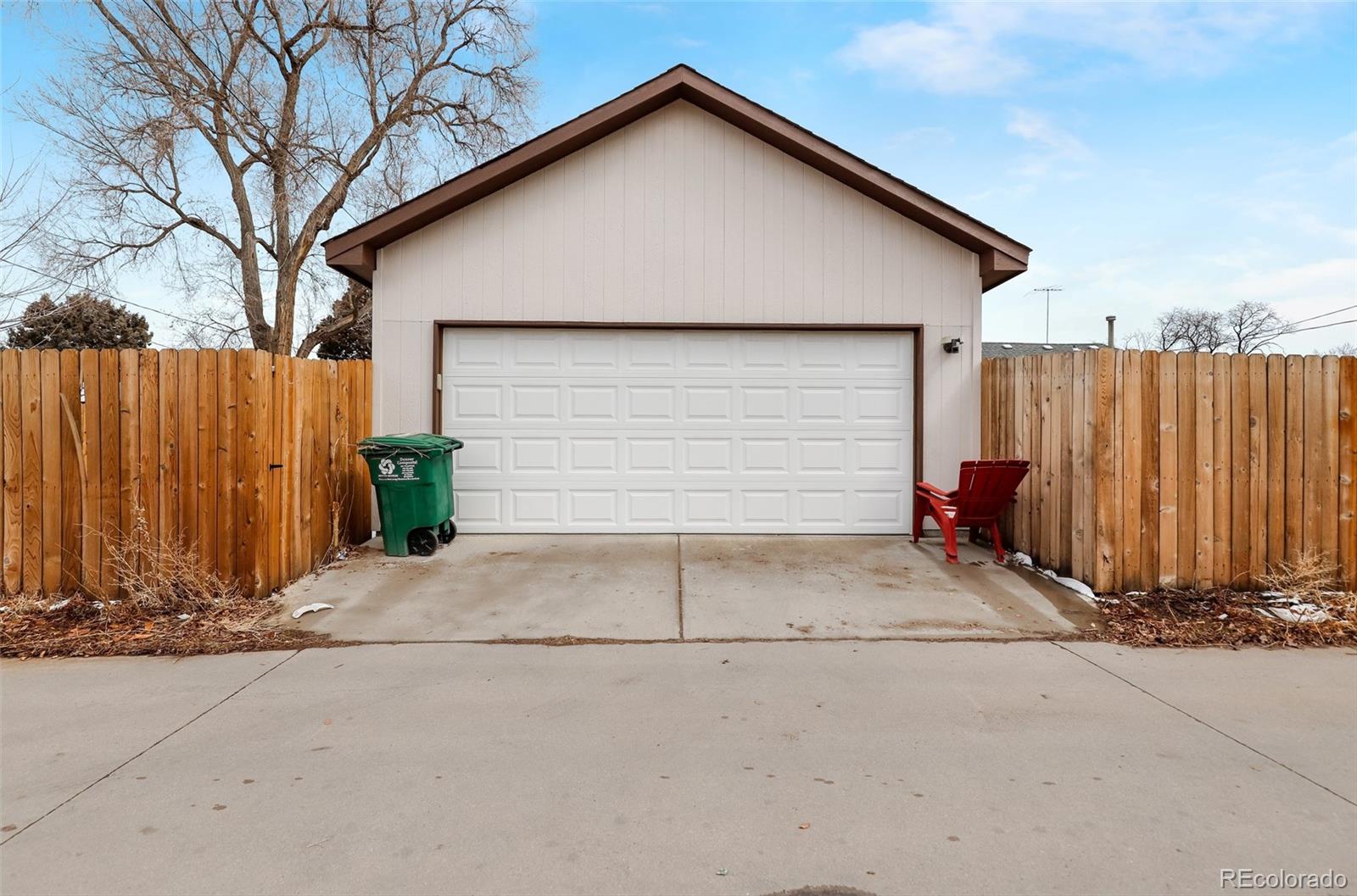 3051 Grape Street Denver, CO 80207 - Photo 30 of 33 a view of garage and wooden fence