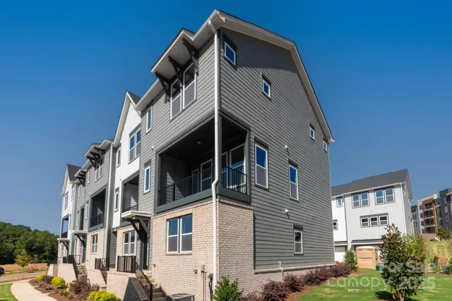a front view of a house with a small yard