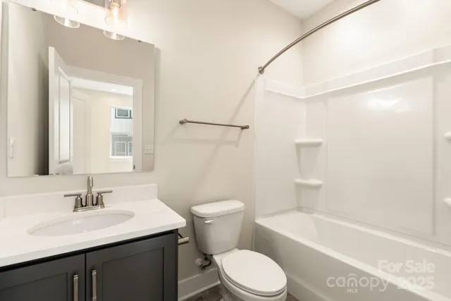 a bathroom with a sink a toilet and a bathtub