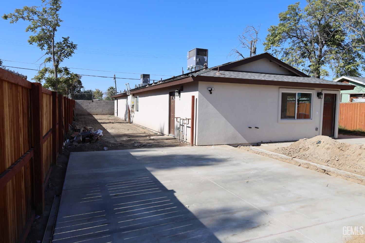 Undisclosed Address Bakersfield, CA 93307 - Photo 1 of 12 a view of a house with a yard