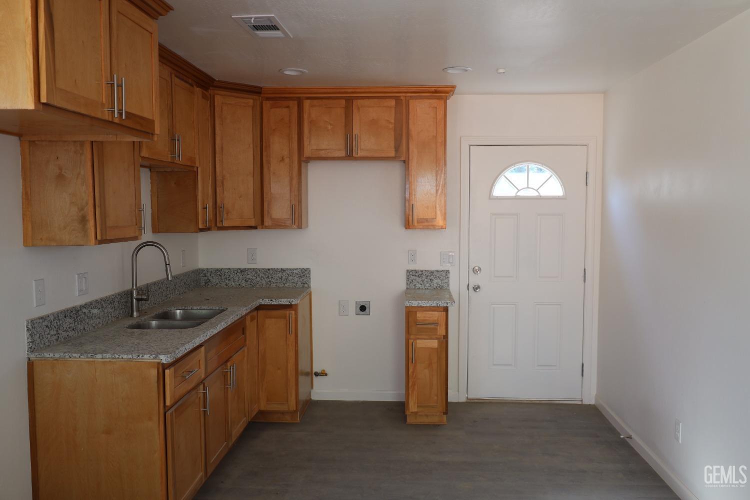 Undisclosed Address Bakersfield, CA 93307 - Photo 6 of 12 a kitchen with sink cabinets and utility