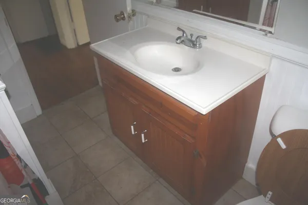 a view of a storage & utility room with a sink
