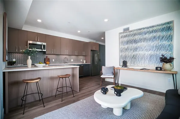a kitchen with a sink cabinets and window